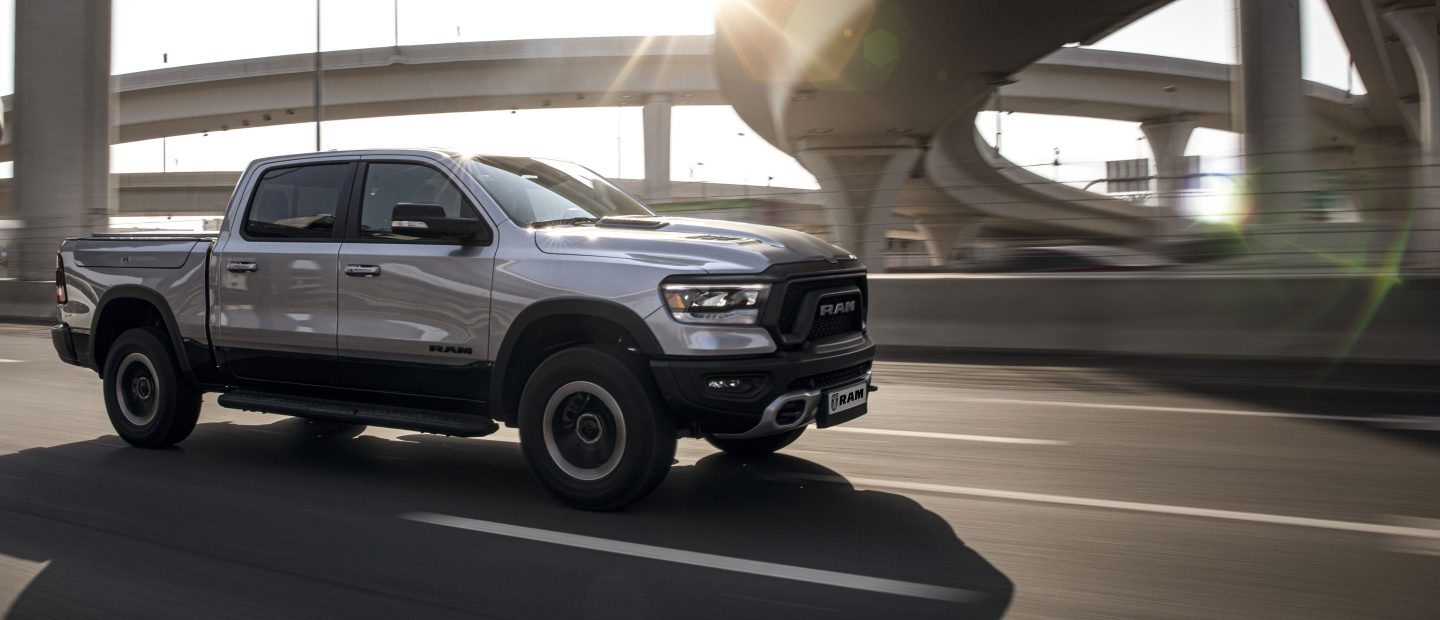 The 2022 Ram 1500 towing a large streamlined trailer.