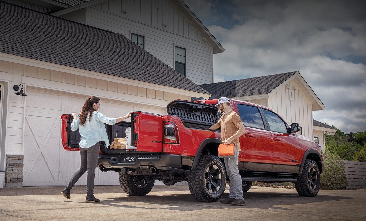 The multifunction tailgate doors of the 2020 Ram 1500 are open, as is the lid of the available RamBox Cargo Management system.