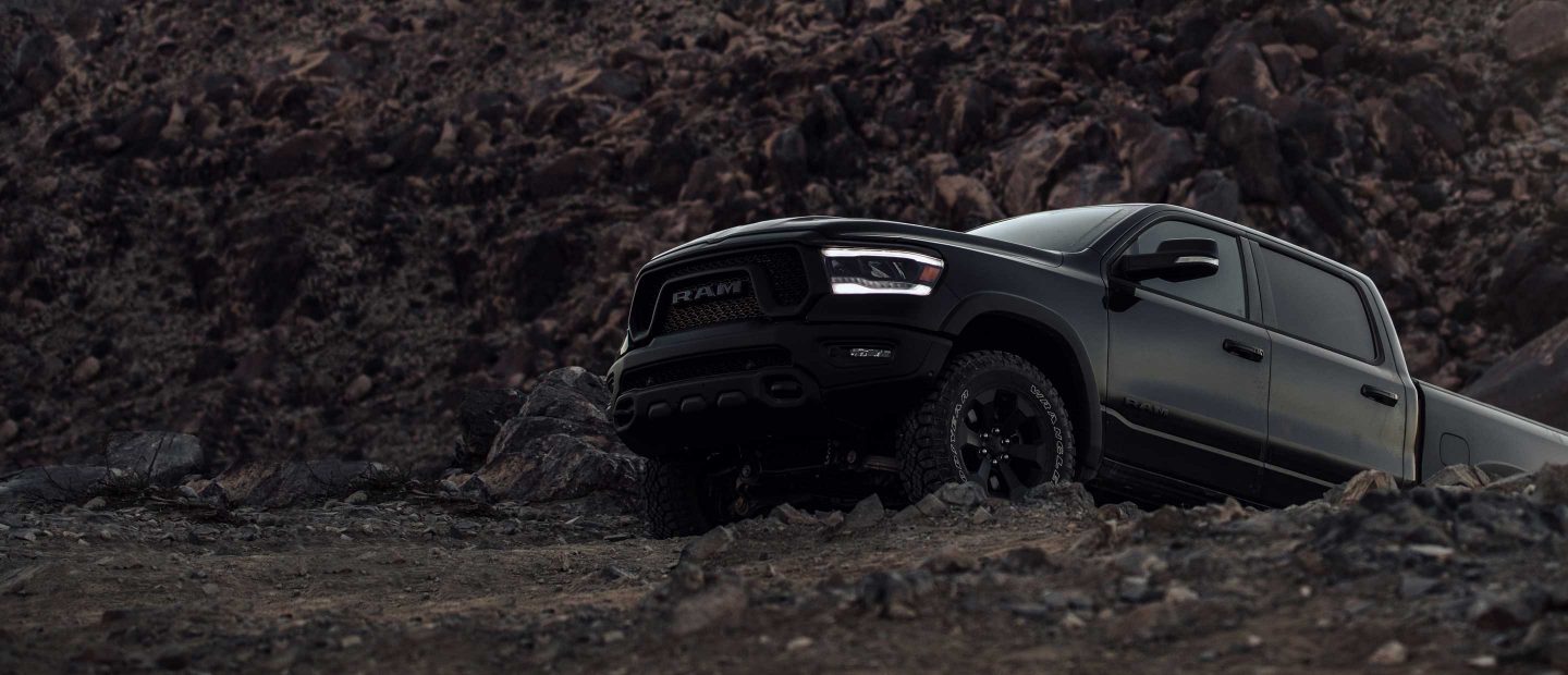 The 2022 Ram 1500 on a rocky, mountainous slope.